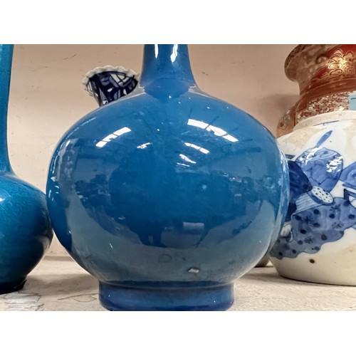 493 - 2 Chinese bulbous turquoise glazed vases with long slender necks, ht 31cm and 22cm