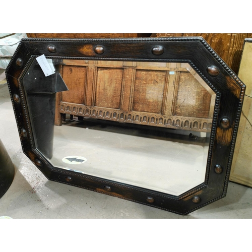 1004 - An oak framed 1930's wall mirror with beaded border with canted edges