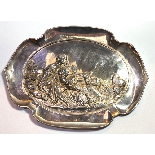 748 - An early 20th century WMF style dish with shaped border, decorated with shepherdess in relief, stamp... 