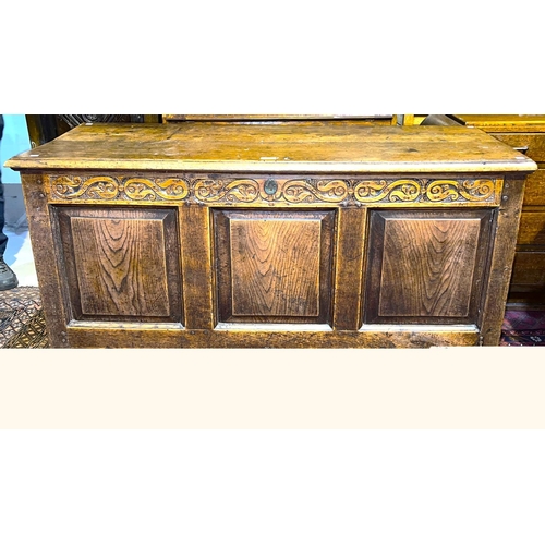 951 - A late 18th/ early 19th century country made oak mule chest with hinged plank top, carved frieze, 3 ... 