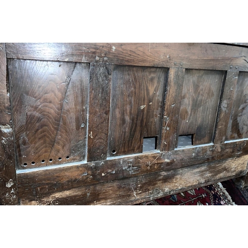 951 - A late 18th/ early 19th century country made oak mule chest with hinged plank top, carved frieze, 3 ... 