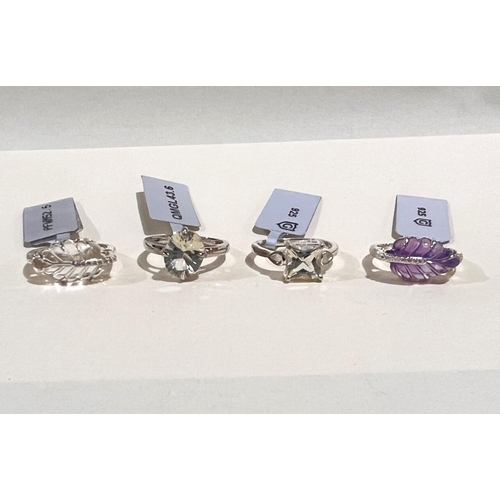 790 - Four hallmarked silver dress rings:- 1 set crystal quartz and white zircon; 1 set Mexican Sunstone; ... 