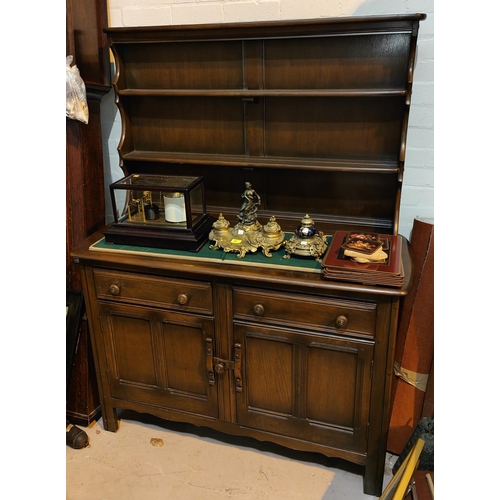 948 - An Ercol modern high back dresser with plate rack over double cupboards, height 161cm, length 120cm