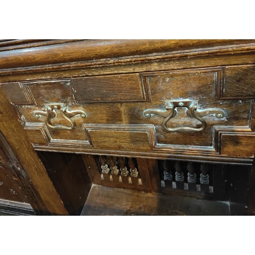 959 - A 19th century Jacobean style large dresser with raised panel back, 2 carved end cupboards, central ... 