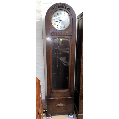 998 - A 1930's grandfather clock in oak dome top case, with triple weight driven movement, height 194cm