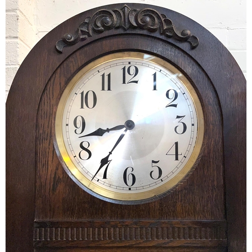 998 - A 1930's grandfather clock in oak dome top case, with triple weight driven movement, height 194cm