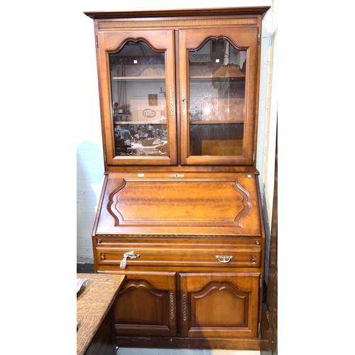 943 - A cherrywood bureau bookcase with fall front, single drawer and double cupboard to base