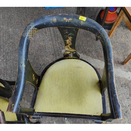 1008 - A Chinese pair of tub chairs decorated iin black & gilt with flowers and traditional scenes