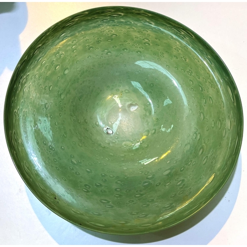 535 - A Scottish art circular fruit dish in green glass with bubble inclusions, diameter 36cm, a large Mon... 