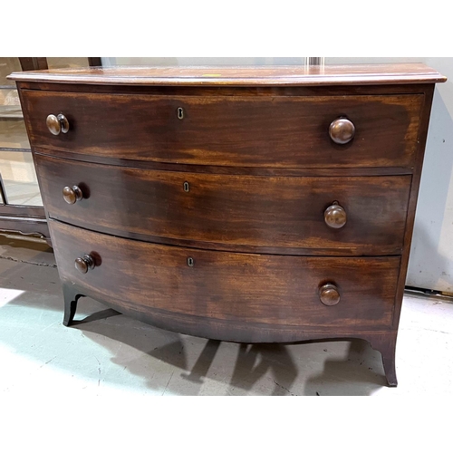 1019 - A Georgian mahogany bow front chest of three long drawers, inlaid around bracket feet length 112 x h... 