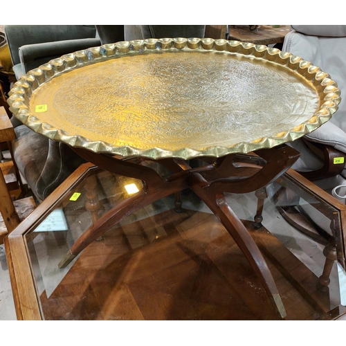 1020 - A brass Middle Eastern table with stylish mid century style base