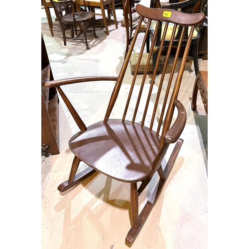 1022 - An Ercol rocking armchair with stick back