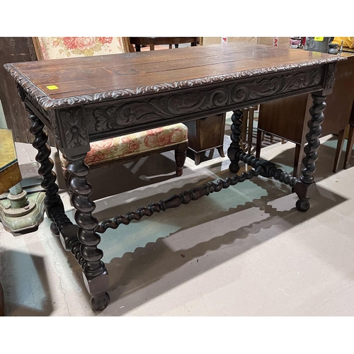 1026 - A carved oak plank top library/desk table with barley twist legs and supports, single drawer, natura... 