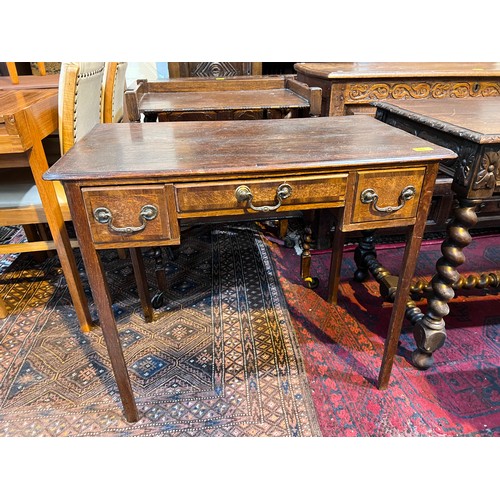 1028 - A Georgian cross banded oak lowboy with squared champhered legs, three drawers ht. 71cm x depth 32cm