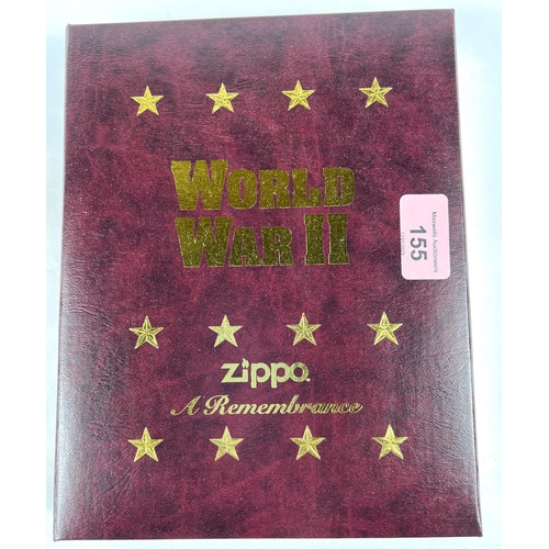 155 - A Zippo WWII Commemorative lighter set in leather style box, with remembrance sheet:  Battle of... 