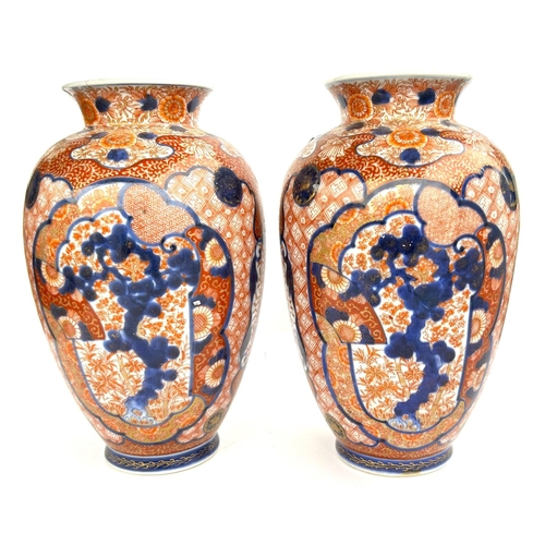 351 - A pair of 19th century Japanese imari pattern vases decorated with fans, flowers etc, gilt highlight... 