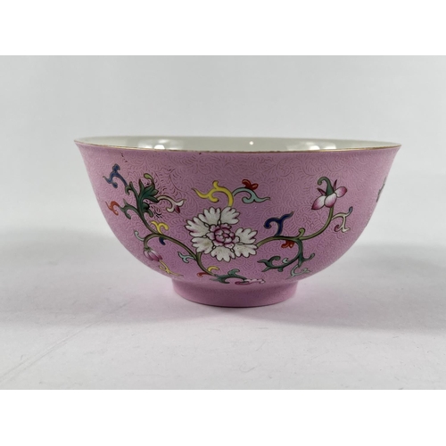 364 - A Chinese famille rose bowl with swirling incised decoration with polychrome flowers and seal mark t... 