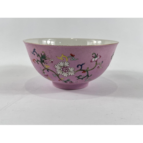 364 - A Chinese famille rose bowl with swirling incised decoration with polychrome flowers and seal mark t... 