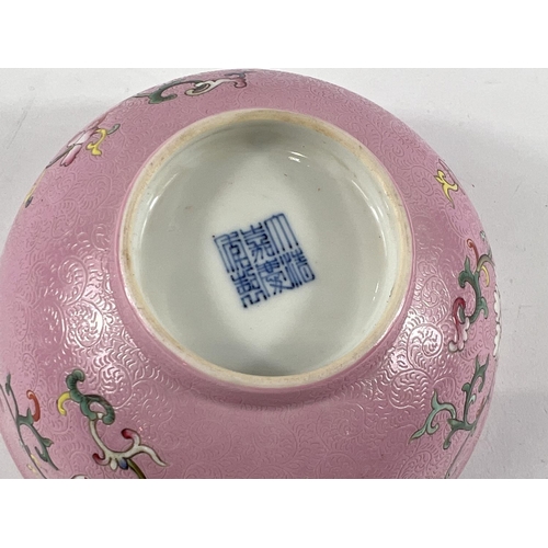 364 - A Chinese famille rose bowl with swirling incised decoration with polychrome flowers and seal mark t... 