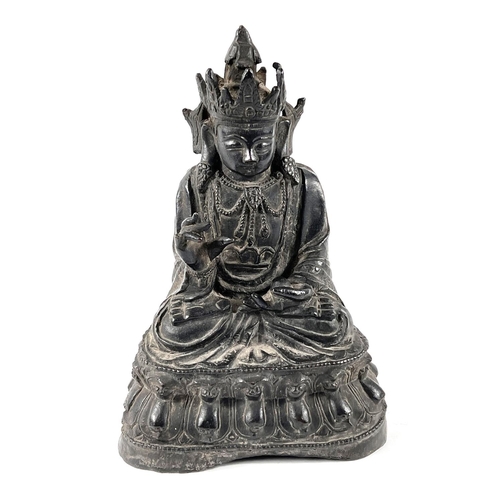 376 - A Chinese Ming period bronze of Guanyin seated with crossed legs, height 23cm