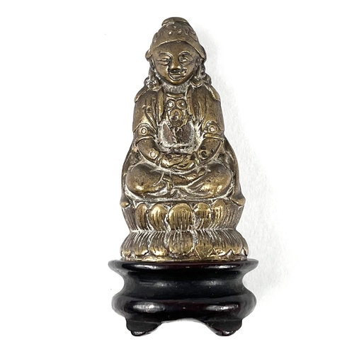 377 - A Circa 1900 Chinese gilt bronze  figure on wooden base, figure seated crossed legs with hands in la... 