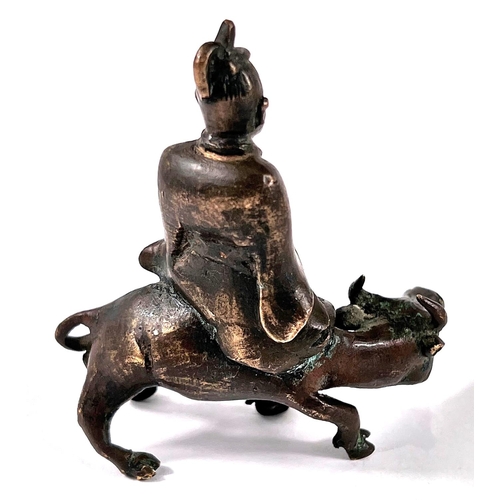 378 - A 19th century Chinese scholars scroll weight depicting man sat on ox length 7cm height 8cm