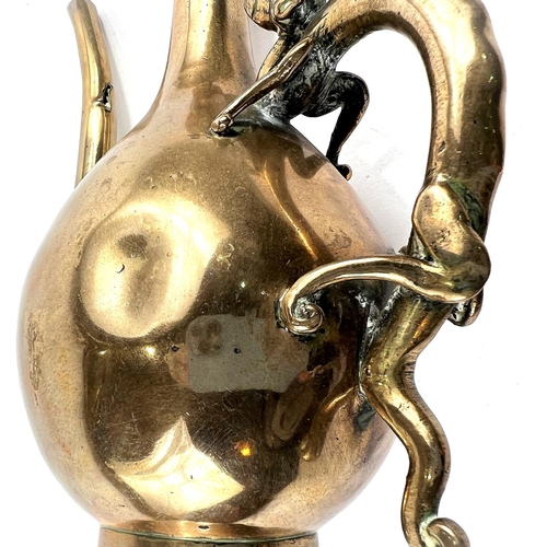 386 - A late 19th/early 19th Chinese polished bronze ewer with dragon handle and dog to lid of finial, hei... 