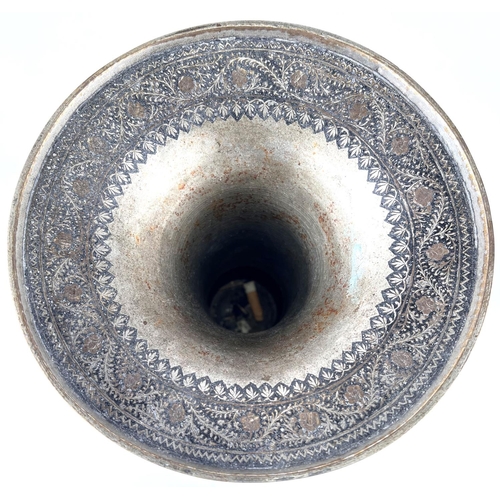 390 - An Indian bronze vase with silver/gilt highlights, flared rim, bulbous body and wide foot