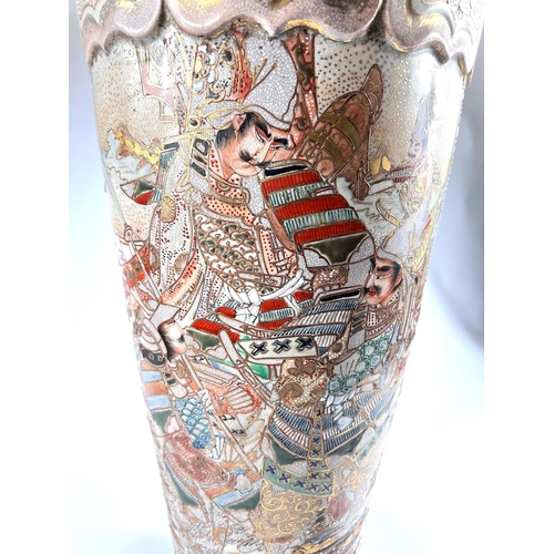 407 - A tall Japanese satsuma crackle glaze vase decorated with warriors in panels, gilt decoration with c... 