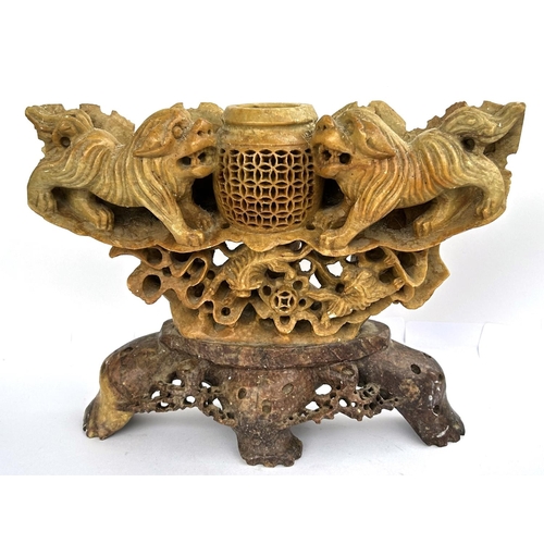 412 - A Chinese carved soapstone ornamental urn on stand, 26cm wide