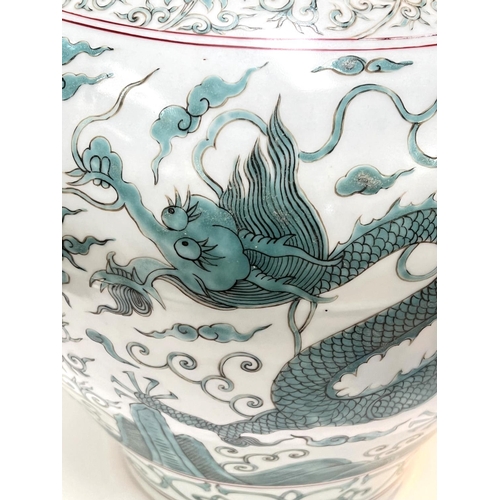 423 - A large Chinese globular shaped dragon vase with turquoise and red decoration, 6 character mark to b... 