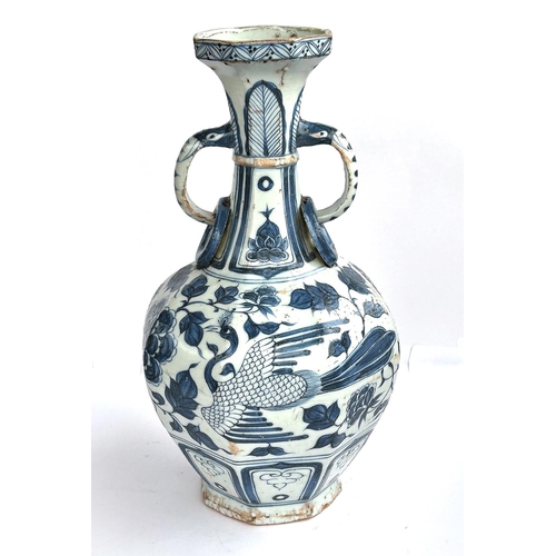 424 - A Chinese blue and white vase in the Yuan manner decorated with birds and double handle, ht. 34cm