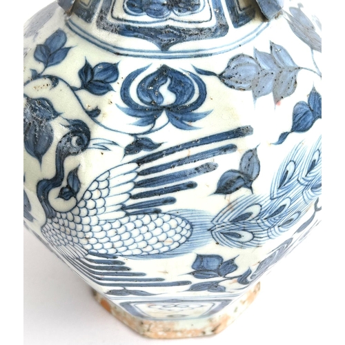 424 - A Chinese blue and white vase in the Yuan manner decorated with birds and double handle, ht. 34cm