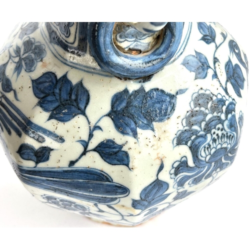 424 - A Chinese blue and white vase in the Yuan manner decorated with birds and double handle, ht. 34cm