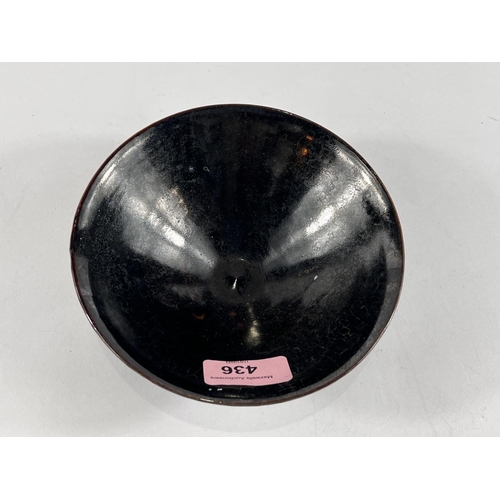 436 - A Chinese dark glazed bowl with small foot, leaf decoration in the glaze, 15cm dia