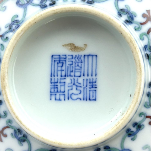 440 - A Chinese famille vert bowl with decoration of scrolling flowers, similar interior, seal mark to bas... 