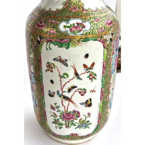 442 - A 19th Chinese Canton vase decorated with traditional scenes on panels to the back and front, cylind... 