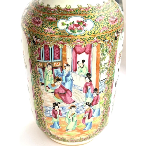 442 - A 19th Chinese Canton vase decorated with traditional scenes on panels to the back and front, cylind... 