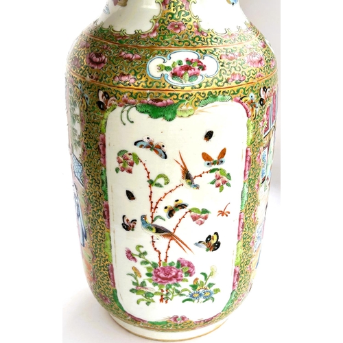 442 - A 19th Chinese Canton vase decorated with traditional scenes on panels to the back and front, cylind... 