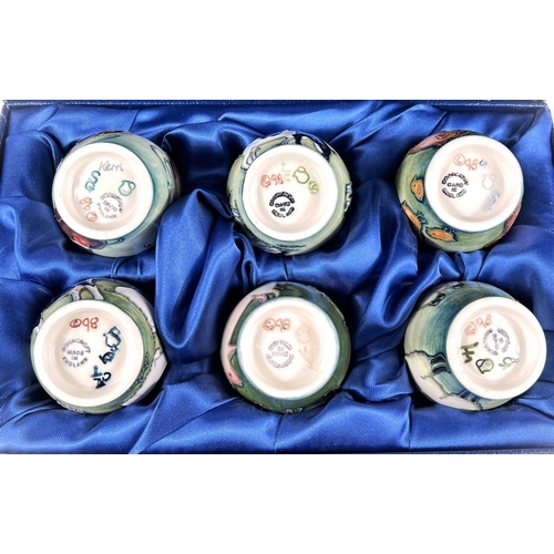 555 - A Moorcroft cased set of 6 eggcups depicting farm animals and birds, printed mark, etc.