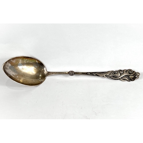 612 - A very large Danish white metal basting spoon, with naturalistic decoration to finial end, Copenhage... 