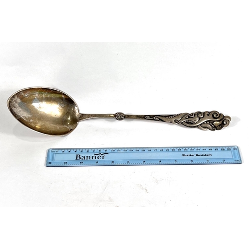 612 - A very large Danish white metal basting spoon, with naturalistic decoration to finial end, Copenhage... 