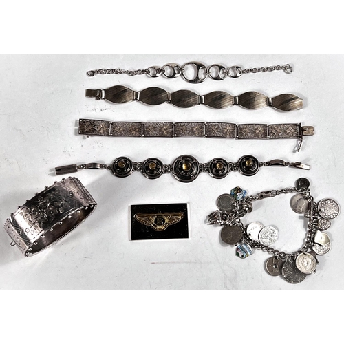 640 - 4 silver bracelets, a silver bangle, a silver charm bracelet with various charms and coins; a hallma... 