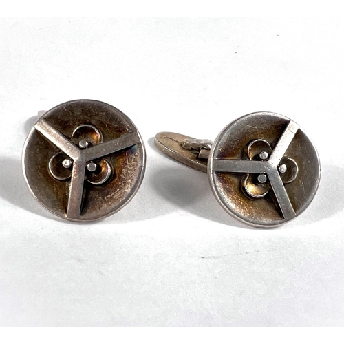 649 - Georg Jensen: a pair of Art Deco design circular silver cufflinks, airplane design, by Oscar Gundela... 