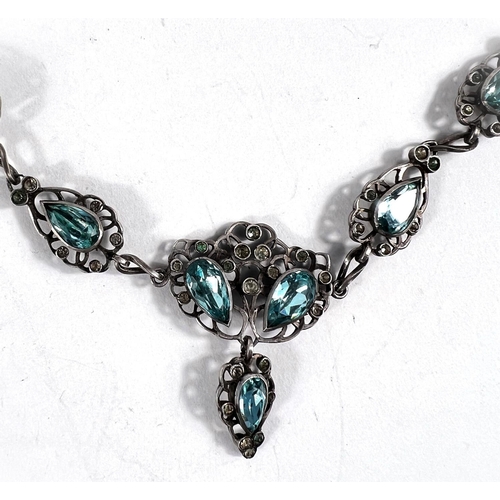 650 - A white metal necklace formed from tear drop shaped pierced links set with clear and aquamarine colo... 