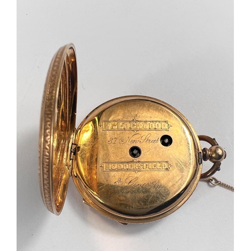 673 - An Edwardian yellow metal fob watch, open faced and key wound with chased decoration, backplate and ... 