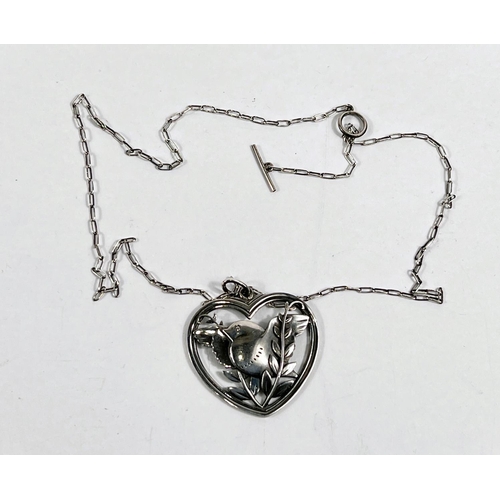 722 - Georg Jensen:  a pierced heart shaped pendant with bird amongst foliage, numbered 97, stamped 9... 