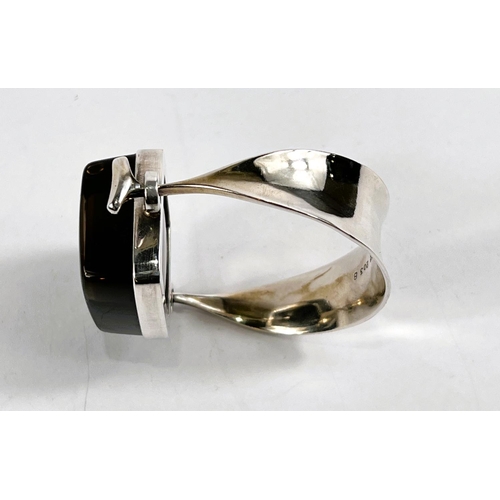 726 - Georg Jensen:  a tapering silver bangle designed by Vivianna Torun Bulow-Hübe, the top set... 