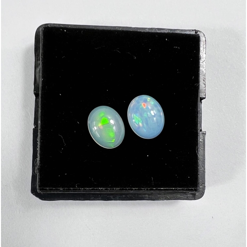 728 - Two oval cabochon cut opals 2.90 carats