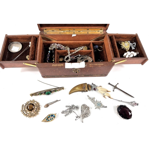 731 - A selection of costume jewellery in leather cantilevered jewellery box